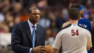 Dec 9, 2013; Philadelphia, PA, USA; Los Angeles Clippers head coach Doc Rivers hands the ball to referee Nick Buchert during the third quarter against the Philadelphia 76ers at the Wells Fargo Center. The Clippers defeated the Sixers 94-83. Mandatory Credit: Howard Smith-USA TODAY Sports