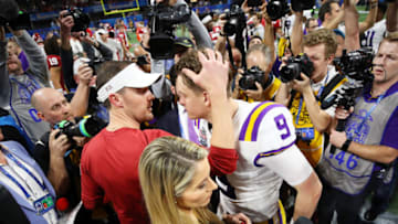 ATLANTA, GEORGIA - DECEMBER 28: Head coach Lincoln Riley of the Oklahoma Sooners and quarterback Joe Burrow #9 of the LSU Tigers embrace after LSU Tigers wins the Chick-fil-A Peach Bowl 28-63 at Mercedes-Benz Stadium on December 28, 2019 in Atlanta, Georgia. (Photo by Gregory Shamus/Getty Images)
