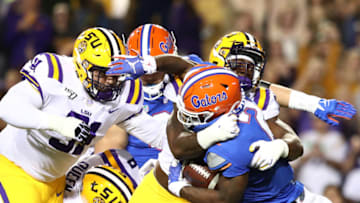 BATON ROUGE, LOUISIANA - OCTOBER 12: Lamical Perine #2 of the Florida Gators runs the ball as LSU Tigers defend at Tiger Stadium on October 12, 2019 in Baton Rouge, Louisiana. (Photo by Marianna Massey/Getty Images)
