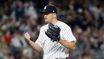 NEW YORK, NY - MAY 09: Jonathan Holder #56 of the New York Yankees reacts to the final out of the eighth inning against the Boston Red Sox at Yankee Stadium on May 9, 2018 in the Bronx borough of New York City. (Photo by Elsa/Getty Images)