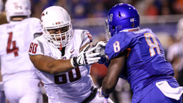 BOISE, ID - SEPTEMBER 10: Offensive lineman Andre Dillard #60 of the Washington State Cougars battles defensive end Jabril Frazier #8 of the Boise State Broncos during second half action on September 10, 2016 at Albertsons Stadium in Boise, Idaho. Boise State won the game 31-28. (Photo by Loren Orr/Getty Images)