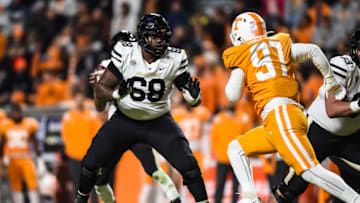 Nov 27, 2021; Knoxville, Tennessee, USA; Vanderbilt Commodores offensive lineman Jason Brooks Jr. (68) blocks Tennessee Volunteers defensive lineman Caleb Tremblay (97) during the second half at Neyland Stadium. Mandatory Credit: Bryan Lynn-USA TODAY Sports