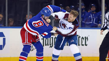 NEW YORK, NEW YORK - DECEMBER 08: Gabriel Landeskog #92 of the Colorado Avalanche and Jacob Trouba #8 of the New York Rangers fight during the second period at Madison Square Garden on December 08, 2021 in New York City. (Photo by Bruce Bennett/Getty Images)