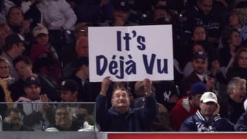 A fan holds up a sign which reads "It's Deja Vu". (Photo by Jed Jacobsohn/Getty Images)