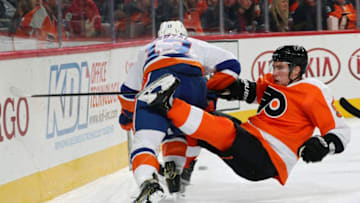 PHILADELPHIA, PA - OCTOBER 27: Ivan Provorov #9 of the Philadelphia Flyers is knocked off balance while colliding along the boards with Matthew Barzal #13 of the New York Islanders on October 27, 2018 at the Wells Fargo Center in Philadelphia, Pennsylvania. (Photo by Len Redkoles/NHLI via Getty Images)