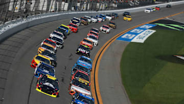 DAYTONA BEACH, FL - FEBRUARY 17: Matt DiBenedetto, driver of the #95 Procore Toyota, leads the field during the Monster Energy NASCAR Cup Series 61st Annual Daytona 500 at Daytona International Speedway on February 17, 2019 in Daytona Beach, Florida. (Photo by Sean Gardner/Getty Images)