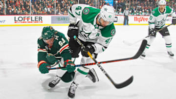 ST. PAUL, MN - DECEMBER 22: Mikael Granlund #64 of the Minnesota Wild and Alexander Radulov #47 of the Dallas Stars battle for the puck during a game at Xcel Energy Center on December 22, 2018 in St. Paul, Minnesota.(Photo by Bruce Kluckhohn/NHLI via Getty Images)