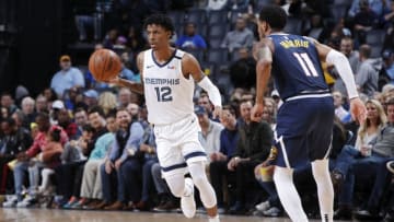 MEMPHIS, TN - JANUARY 28: Ja Morant #12 of the Memphis Grizzlies dribbles the ball up court during a game against the Denver Nuggets at FedExForum on January 28, 2020 in Memphis, Tennessee. Memphis defeated Denver 104-96. NOTE TO USER: User expressly acknowledges and agrees that, by downloading and or using this Photograph, user is consenting to the terms and conditions of the Getty Images License Agreement. (Photo by Joe Robbins/Getty Images)