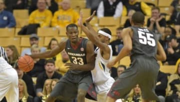 Jan 12, 2016; Columbia, MO, USA; Arkansas Razorbacks forward Moses Kingsley (33) posts up defended by Missouri Tigers forward Russell Woods (25) during the second half at Mizzou Arena. Arkansas won 94-61. Mandatory Credit: Denny Medley-USA TODAY Sports