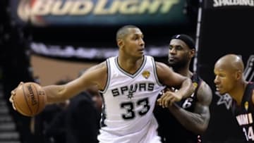 Jun 15, 2014; San Antonio, TX, USA; San Antonio Spurs forward Boris Diaw (33) handles the ball against Miami Heat forward LeBron James (6) during the fourth quarter in game five of the 2014 NBA Finals at AT&T Center. Mandatory Credit: Bob Donnan-USA TODAY Sports