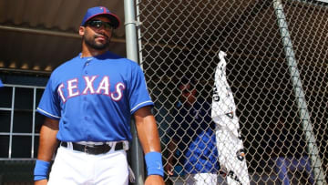 Mar 28, 2015; Surprise, AZ, USA; Seattle Seahawks quarterback Russell Wilson practices with the Texas Rangers on the practice fields at Surprise Stadium. Mandatory Credit: Mark J. Rebilas-USA TODAY Sports
