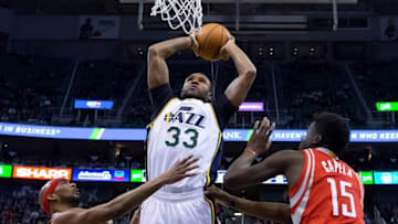 Feb 23, 2016; Salt Lake City, UT, USA; Utah Jazz forward Trevor Booker (33) dunks the ball over Houston Rockets guard Corey Brewer (33) and forward Clint Capela (15) during the first half at Vivint Smart Home Arena. Mandatory Credit: Russ Isabella-USA TODAY Sports