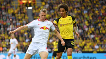 DORTMUND, GERMANY - AUGUST 26: Axel Witsel of Dortmund is challenged by Lukas Klostermann of Leipzig during the Bundesliga match between Borussia Dortmund and RB Leipzig at Signal Iduna Park on August 26, 2018 in Dortmund, Germany. (Photo by Stuart Franklin/Bundesliga/DFL via Getty Images )