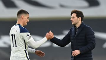 Tottenham Hotspur's head coach Ryan Mason (R) reacts with Tottenham Hotspur's Argentinian midfielder Erik Lamela at the final whistle during the English Premier League football match between Tottenham Hotspur and Southampton at Tottenham Hotspur Stadium in north London on April 21, 2021. - - RESTRICTED TO EDITORIAL USE. No use with unauthorized audio, video, data, fixture lists, club/league logos or 'live' services. Online in-match use limited to 120 images. An additional 40 images may be used in extra time. No video emulation. Social media in-match use limited to 120 images. An additional 40 images may be used in extra time. No use in betting publications, games or single club/league/player publications. (Photo by Justin Setterfield / POOL / AFP) / RESTRICTED TO EDITORIAL USE. No use with unauthorized audio, video, data, fixture lists, club/league logos or 'live' services. Online in-match use limited to 120 images. An additional 40 images may be used in extra time. No video emulation. Social media in-match use limited to 120 images. An additional 40 images may be used in extra time. No use in betting publications, games or single club/league/player publications. / RESTRICTED TO EDITORIAL USE. No use with unauthorized audio, video, data, fixture lists, club/league logos or 'live' services. Online in-match use limited to 120 images. An additional 40 images may be used in extra time. No video emulation. Social media in-match use limited to 120 images. An additional 40 images may be used in extra time. No use in betting publications, games or single club/league/player publications. (Photo by JUSTIN SETTERFIELD/POOL/AFP via Getty Images)