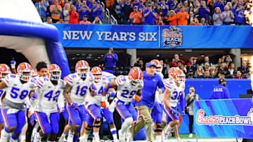 ATLANTA, GEORGIA - DECEMBER 29: Head coach Dan Mullen of the Florida Gators leads his team out of the tunnel prior to the Chick-fil-A Peach Bowl against the Michigan Wolverines at Mercedes-Benz Stadium on December 29, 2018 in Atlanta, Georgia. (Photo by Scott Cunningham/Getty Images)