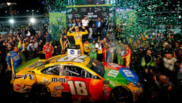 HOMESTEAD, FLORIDA - NOVEMBER 17: Kyle Busch, driver of the #18 M&M's Toyota, celebrates in Victory Lane after winning the Monster Energy NASCAR Cup Series Ford EcoBoost 400 and the Monster Energy NASCAR Cup Series Championship at Homestead Speedway on November 17, 2019 in Homestead, Florida. (Photo by Jonathan Ferrey/Getty Images)