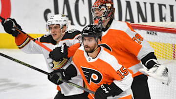 Dec 17, 2019; Philadelphia, PA, USA; Philadelphia Flyers defenseman Matt Niskanen (15) and Anaheim Ducks right wing Jakob Silfverberg (33) battle for position in front of goaltender Carter Hart (79) during the third period at Wells Fargo Center. Mandatory Credit: Eric Hartline-USA TODAY Sports