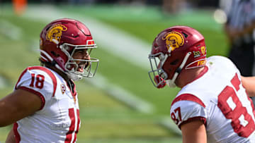 BOULDER, CO - SEPTEMBER 30: Tight end Jude Wolfe #18 of the USC Trojans celebrates after a third quarter touchdown catch with tight end Lake McRee #87 in the third quarter against the Colorado Buffaloes at Folsom Field on September 30, 2023 in Boulder, Colorado. (Photo by Dustin Bradford/Getty Images)