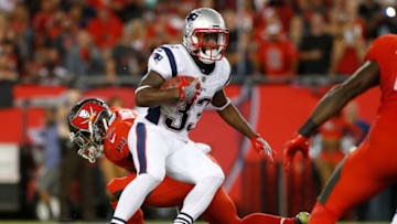 TAMPA, FL - OCTOBER 5: Running back Dion Lewis #33 of the New England Patriots evades linebacker Cameron Lynch #52 of the Tampa Bay Buccaneers during a carry in the first quarter of an NFL football game on October 5, 2017 at Raymond James Stadium in Tampa, Florida. (Photo by Brian Blanco/Getty Images)