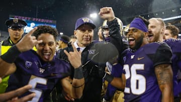 SEATTLE, WA - NOVEMBER 25: Head coach Chris Petersen of the Washington Huskies celebrates with his team after defeating the Washington State Cougars 41-14 at Husky Stadium on November 25, 2017 in Seattle, Washington. (Photo by Otto Greule Jr/Getty Images)