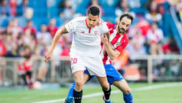 MADRID, SPAIN - MARCH 19: Victor Machin Perez Vitolo of Sevilla FC competes for the ball with Juan Francisco Torres Belen, Juanfran, of Atletico de Madrid during their La Liga match between Atletico de Madrid and Sevilla FC at the Estadio Vicente Calderon on 19 March 2017 in Madrid, Spain. Photo by Diego Gonzalez Souto / Power Sport Images
