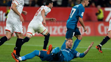 Real Madrid's Spanish defender Sergio Ramos (C) reacts during the Spanish league football match between Sevilla and Real Madrid at the Ramon Sanchez Pizjuan stadium in Sevilla on May 9, 2018. (Photo by CRISTINA QUICLER / AFP) (Photo credit should read CRISTINA QUICLER/AFP/Getty Images)