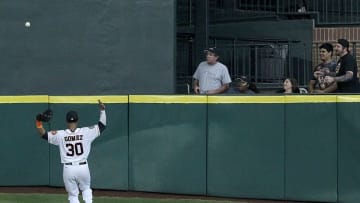 Sep 2, 2015; Houston, TX, USA; Houston Astros center fielder Carlos Gomez (30) calls time out on top of Talls Hill in the centerfield after Seattle Mariners left fielder Franklin Gutierrez (30) hit a ground rule double in the top of the third inning at Minute Maid Park. Mandatory Credit: Thomas B. Shea-USA TODAY Sports