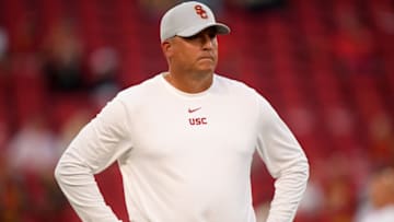 LOS ANGELES, CALIFORNIA - AUGUST 31: Head coach Clay Helton of the USC Trojans watches warm up before the game against the Fresno State Bulldogs at Los Angeles Memorial Coliseum on August 31, 2019 in Los Angeles, California. (Photo by Harry How/Getty Images)