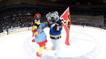 ST. LOUIS, MO - MARCH 23: St. Louis Cardinals mascot Fredbird and St. Louis Blues mascot Louie pose for a photograph after a game against the Vancouver Canucks on March 23, 2017 at Scottrade Center in St. Louis, Missouri. (Photo by Scott Rovak/NHLI via Getty Images)