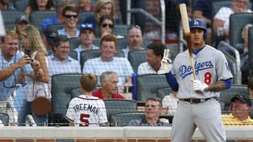 ATLANTA, GA - JULY 26: Third baseman Manny Machado #8 of the Los Angeles Dodgers gestures for a fan picture in the fourth inning during the game against the Atlanta Braves at SunTrust Park on July 26, 2018 in Atlanta, Georgia. (Photo by Mike Zarrilli/Getty Images)