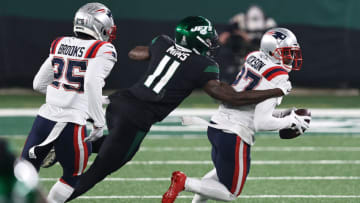 EAST RUTHERFORD, NEW JERSEY - NOVEMBER 09: J.C. Jackson #27 of the New England Patriots intercepts a pass intended for Denzel Mims #11 of the New York Jets during the second half at MetLife Stadium on November 09, 2020 in East Rutherford, New Jersey. (Photo by Elsa/Getty Images)