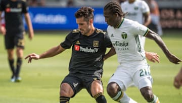 LOS ANGELES, CA - JULY 15: Benny Feilhaber #33 of Los Angeles FC battles Diego Chara #21 of Portland Timbers at the Banc of California Stadium on July 15, 2018 in Los Angeles, California. The match ended in a 0-0 draw.(Photo by Shaun Clark/Getty Images)