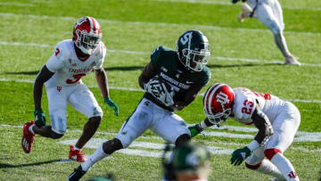 Michigan State wide receiver Jayden Reed is defended by Indiana defensive back Tiawan Mullen, left, and Indiana defensive back Jaylin Williams during the second half of MSU's 24-0 loss to Indiana at Spartan Stadium on Saturday, Nov. 14, 2020.