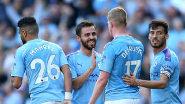 MANCHESTER, ENGLAND - SEPTEMBER 21: Kevin De Bruyne of Manchester City (17) celebrates as he scores his team's eighth goal with Bernardo Silva, David Silva and Riyad Mahrez of Manchester City during the Premier League match between Manchester City and Watford FC at Etihad Stadium on September 21, 2019 in Manchester, United Kingdom. (Photo by Matt McNulty - Manchester City/Manchester City FC via Getty Images)