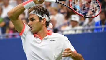 Sep 11, 2015; New York, NY, USA; Roger Federer of Switzerland hits to Stan Wawrinka of Switzerland on day twelve of the 2015 U.S. Open tennis tournament at USTA Billie Jean King National Tennis Center. Mandatory Credit: Robert Deutsch-USA TODAY Sports
