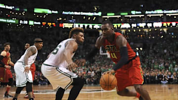 Apr 24, 2016; Boston, MA, USA; Atlanta Hawks forward Paul Millsap (4) controls the ball while Boston Celtics guard Marcus Smart (36) defends during overtime in game four of the first round of the NBA Playoffs at TD Garden. Mandatory Credit: Bob DeChiara-USA TODAY Sports