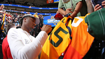 SACRAMENTO, CA - JULY 3: Donovan Mitchell #45 of the Utah Jazz signs autographs for fans during the game against the Utah Jazz and Memphis Grizzlies on July 3, 2018 at Golden 1 Center in Sacramento, California. Copyright 2018 NBAE (Photo by Melissa Majchrzak/NBAE via Getty Images)