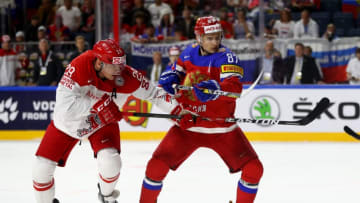COLOGNE, GERMANY - MAY 11: Vadim Shipachyov #87 of Russia challenges Morten Madsen of Denmark for the puck during the 2017 IIHF Ice Hockey World Championship game between Russia and Denmark at Lanxess Arena on May 11, 2017 in Cologne, Germany. (Photo by Martin Rose/Bongarts/Getty Images )