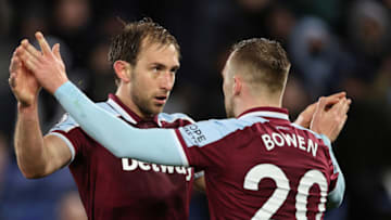 LEICESTER, ENGLAND - FEBRUARY 13: Craig Dawson of West Ham United celebrates after scoring a goal to make it 2-2 with Jarrod Bowen during the Premier League match between Leicester City and West Ham United at The King Power Stadium on February 13, 2022 in Leicester, United Kingdom. (Photo by James Williamson - AMA/Getty Images)