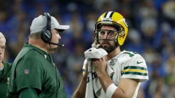 Coach Mike McCarthy talks with Green Bay Packers quarterback Aaron Rodgers during a break in the second half during the Green Bay Packers 31-23 loss to the Detroit Lions at Ford Field.Packlions 32ofx Wood