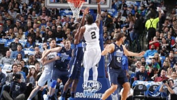 DALLAS, TX - DECEMBER 12: Kawhi Leonard #2 of the San Antonio Spurs shoots the ball against the Dallas Mavericks on December 12, 2017 at the American Airlines Center in Dallas, Texas. NOTE TO USER: User expressly acknowledges and agrees that, by downloading and or using this photograph, User is consenting to the terms and conditions of the Getty Images License Agreement. Mandatory Copyright Notice: Copyright 2017 NBAE (Photo by Glenn James/NBAE via Getty Images)
