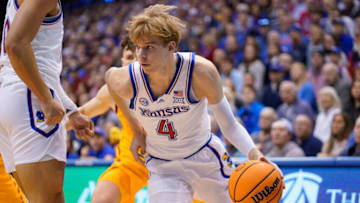 LAWRENCE, KANSAS - JANUARY 14: Gradey Dick #4 of the Kansas Jayhawks drives to the basket against the Iowa State Cyclones at Allen Fieldhouse on January 14, 2023 in Lawrence, Kansas. (Photo by Ed Zurga/Getty Images)