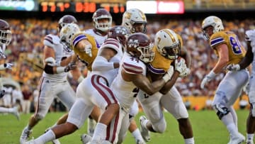 Sep 17, 2016; Baton Rouge, LA, USA; LSU Tigers running back Leonard Fournette (7) runs for a touchdown against Mississippi State Bulldogs linebacker Leo Lewis (44) during the first quarter of a game at Tiger Stadium. Mandatory Credit: Derick E. Hingle-USA TODAY Sports