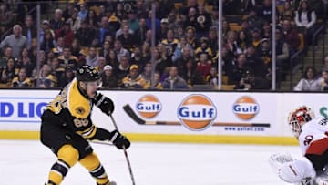 Apr 9, 2016; Boston, MA, USA; Boston Bruins left wing David Pastrnak (88) shoots the puck on Ottawa Senators goalie Andrew Hammond (30) during the first period at TD Garden. Mandatory Credit: Bob DeChiara-USA TODAY Sports