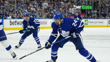 May 4, 2022; Toronto, Ontario, CAN; Toronto Maple Leafs forward Wayne Simmonds (24) tries to control the puck against the Tampa Bay Lightning during the first period of game two of the first round of the 2022 Stanley Cup Playoffs at Scotiabank Arena. Mandatory Credit: John E. Sokolowski-USA TODAY Sports