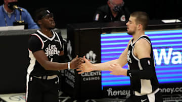 LOS ANGELES, CALIFORNIA - APRIL 09: Reggie Jackson #1 of the Los Angeles Clippers celebrates with Ivica Zubac #40 after making a three point basket against the Houston Rockets during the fourth quarter at Staples Center on April 09, 2021 in Los Angeles, California. NOTE TO USER: User expressly acknowledges and agrees that, by downloading and or using this photograph, User is consenting to the terms and conditions of the Getty Images License Agreement. (Photo by Katelyn Mulcahy/Getty Images)