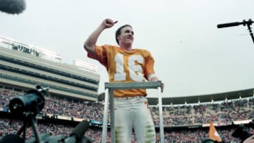 Tennessee quarterback and "maestro" Peyton Manning leads the Vols' Pride of the Southland Band in a rendition of "Rocky Top" after the No. 3 ranked Volunteers closed out Vanderbilt 17-10 at Neyland Stadium in Knoxville Nov. 29, 1997. Tennessee earned its first ever trip to the SEC Championship game to faced Auburn.