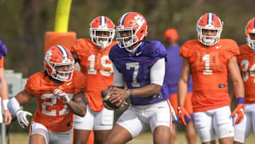 Clemson quarterback Taisun Phommachanh(7) hands off to running back Chez Mellusi(27) during football practice in Clemson, S.C. Monday, March 22, 2021.Clemson Spring Football Practice