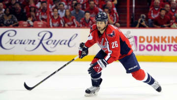 WASHINGTON, DC - MAY 10: Matt Hendricks #26 of the Washington Capitals skates down the ice against the New York Rangers in Game Five of the Eastern Conference Quarterfinals during the 2013 NHL Stanley Cup Playoffs at the Verizon Center on May 10, 2013 in Washington, DC. (Photo by G Fiume/Getty Images)