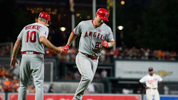 BALTIMORE, MD - AUGUST 19: Mike Trout #27 of the Los Angeles Angels of Anaheim celebrates with third base coach Ron Roenicke #10 as he runs the bases after hitting a solo home run in the third inning against the Baltimore Orioles during a game at Oriole Park at Camden Yards on August 19, 2017 in Baltimore, Maryland. (Photo by Patrick McDermott/Getty Images)